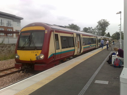 170478 awaits departure at a busy Alloa station