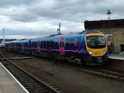 185126 arrives at Huddersfield under thunderous clouds