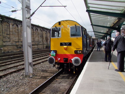 Immaculate ex-works 20301 leads the train back into the platform