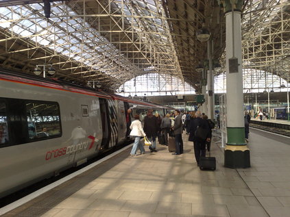 221136 empties passengers on arrival from Bristol under the impressive roof at Piccadilly