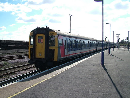 Two generations of Southern stock - 3810 leaving Eastleigh...