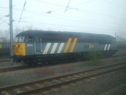 56303 emerges from the mist at Doncaster RMT