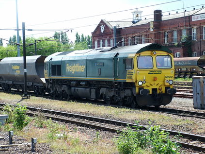 In a sudden burst of sunshine, 66552 'Maltby Raider' passes Doncaster