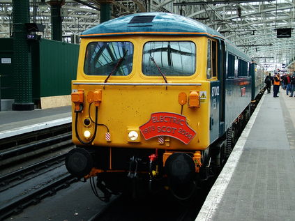 87002 at Glasgow Central with commemorative Electric Scot headboard