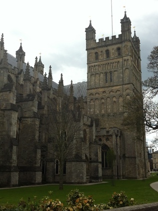 Exeter Cathedral Towers over the green