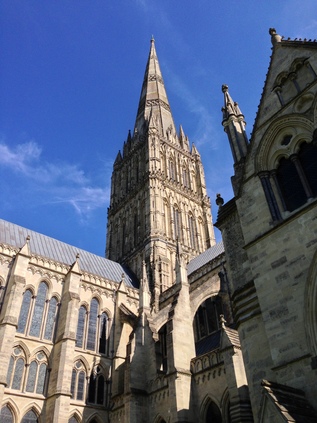 Salisbury Cathedral towers into a blue sky